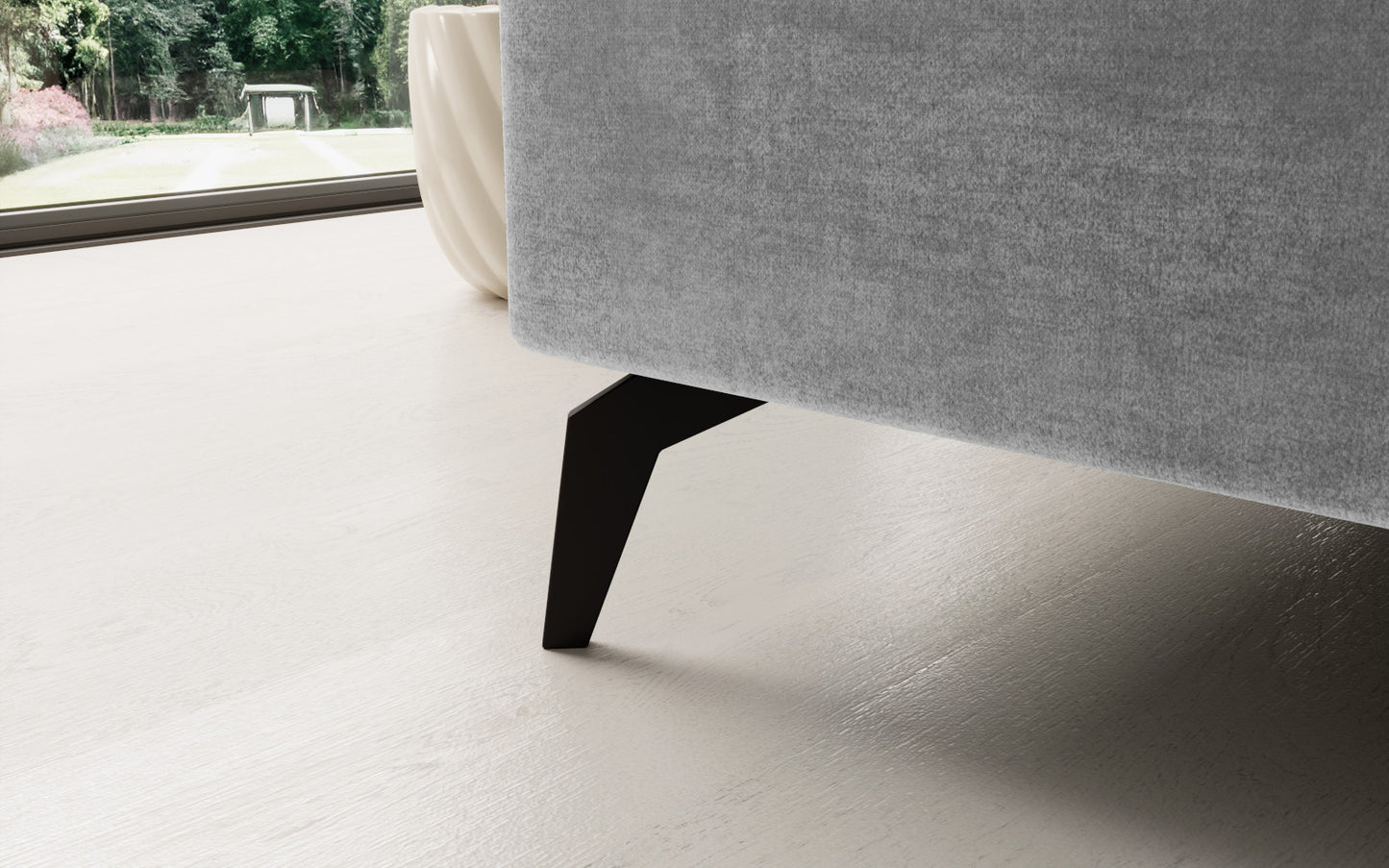 Jasnoszary narożnik Solange Monolith 84 lewostronny to designerski mebel do salonu, który dzięki miękkim poduszkom i stonowanej kolorystyce tworzy przytulną, nowoczesną strefę wypoczynku.