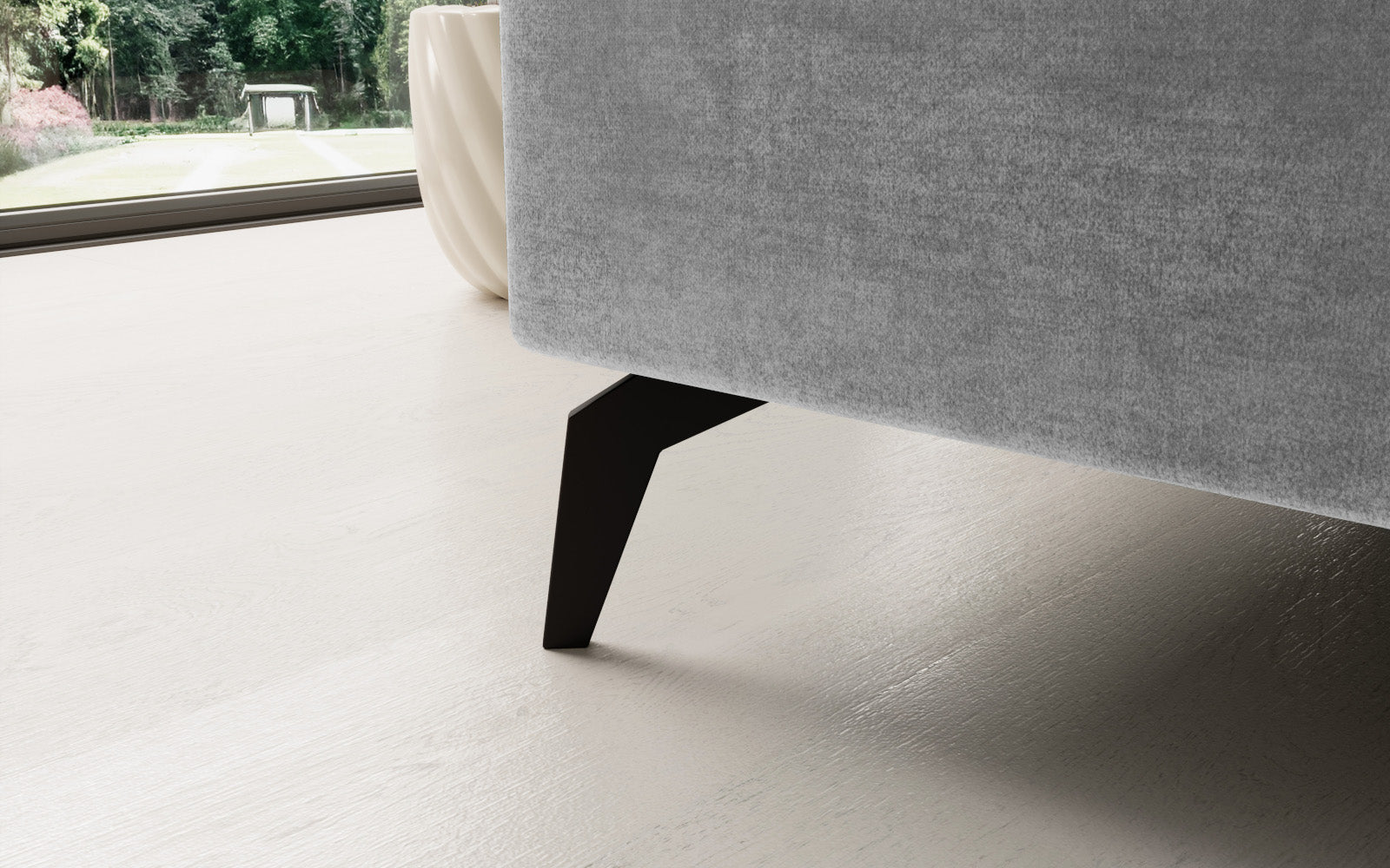 Jasnoszary narożnik Solange Monolith 84 lewostronny to designerski mebel do salonu, który dzięki miękkim poduszkom i stonowanej kolorystyce tworzy przytulną, nowoczesną strefę wypoczynku.