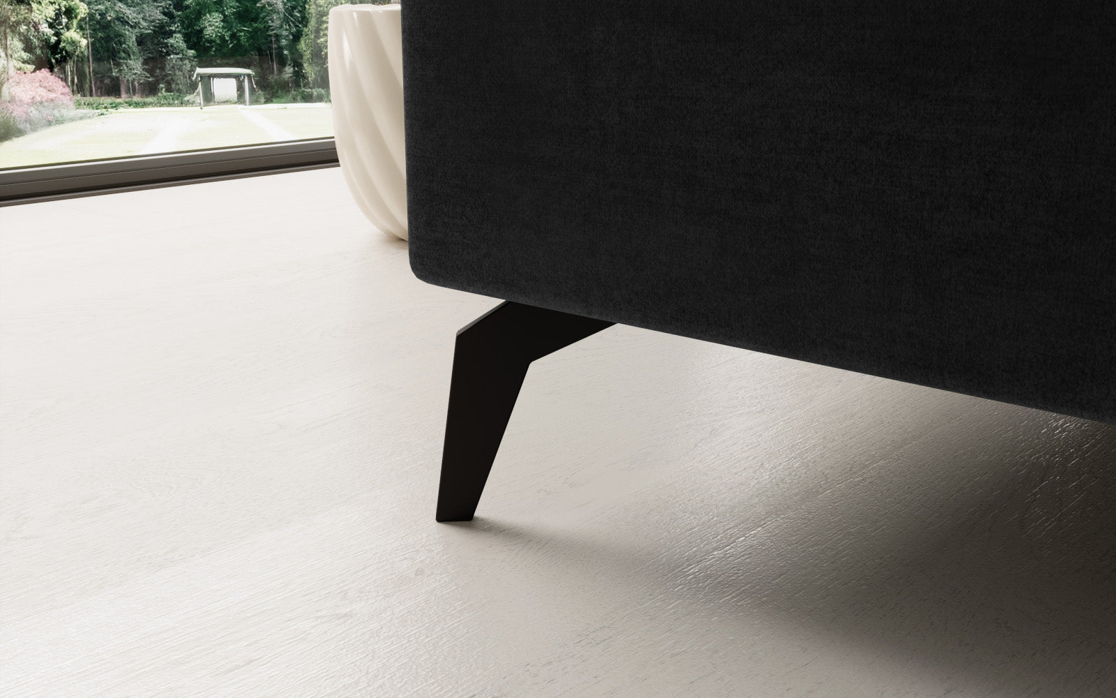 Ciemnoszary narożnik Solange Monolith 97 lewostronny to designerski mebel do salonu, który dzięki miękkim poduszkom i dopracowanym detalom tworzy nowoczesną, przytulną strefę wypoczynku.