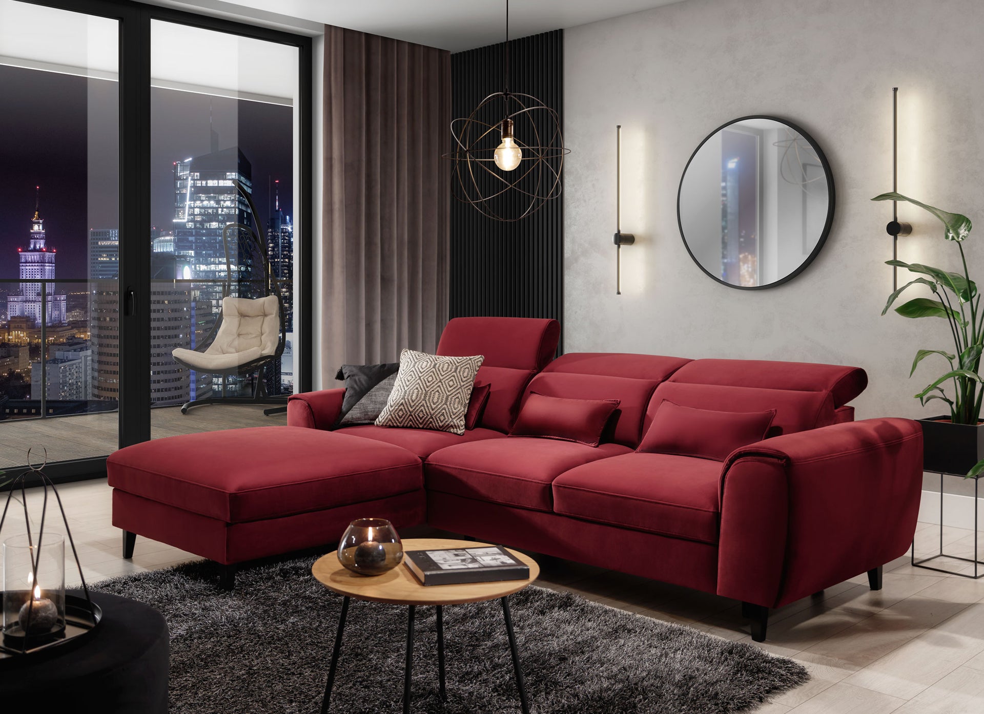 Nowoczesny salon z dywanem Blodwen Black 120x180 cm, bordową sofą narożną i widokiem na nocne miasto.