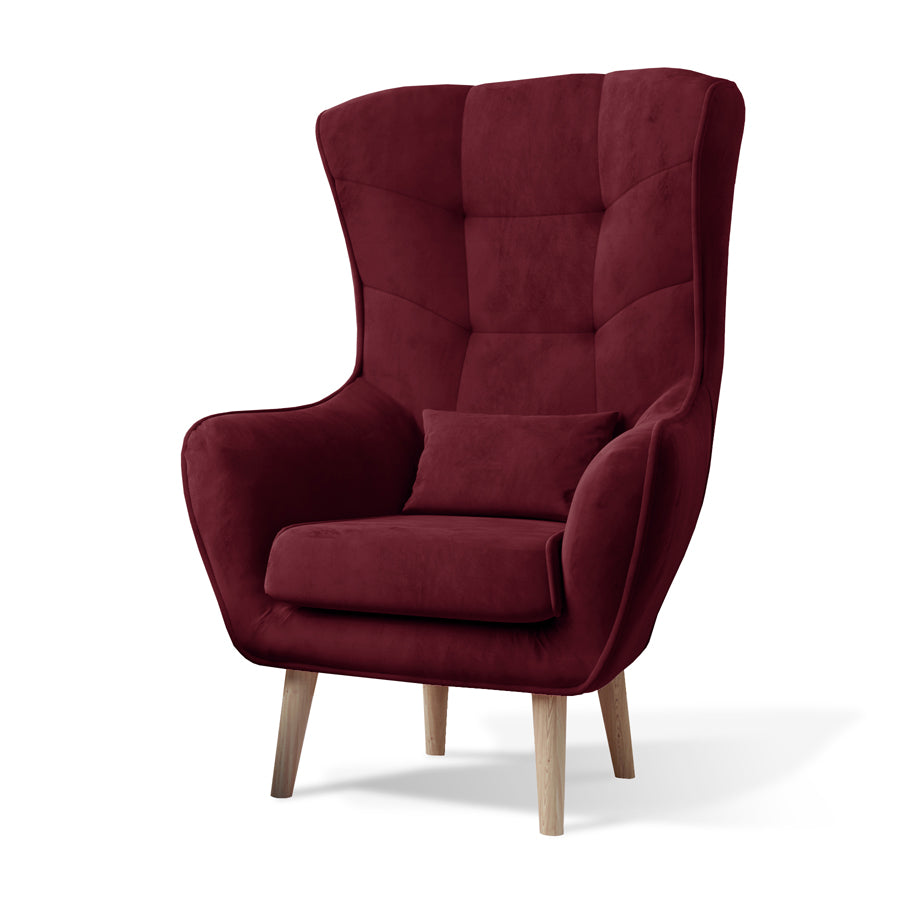 Fotel Arti w kolorze Matt Velvet 68 bordowy, elegancki fotel uszak z wysokim oparciem, miękką poduszką i drewnianymi nogami.