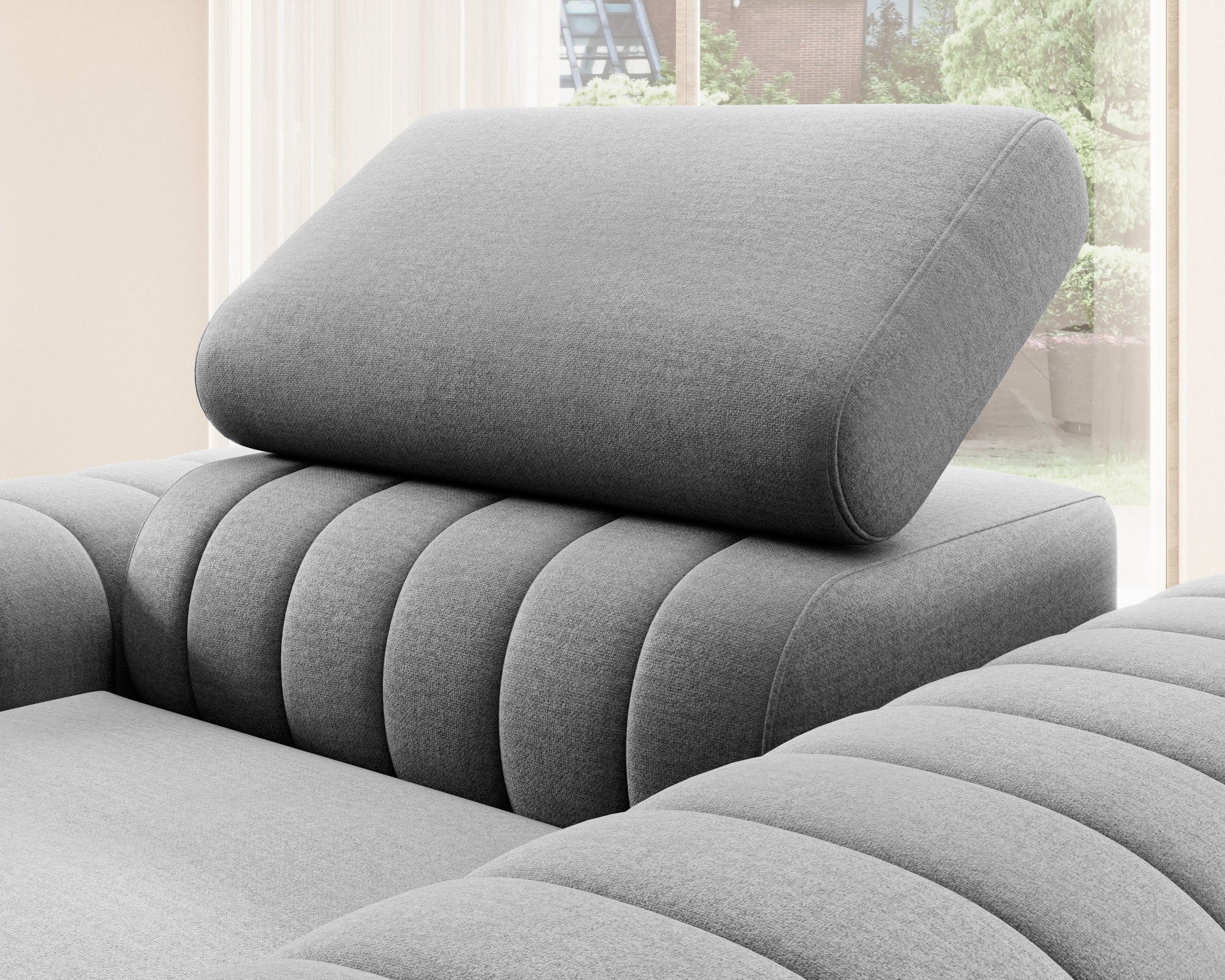 Zbliżenie na zagłówek fotela Laurence Nube 04 szary – regulowany, komfortowy element o zaokrąglonym kształcie.