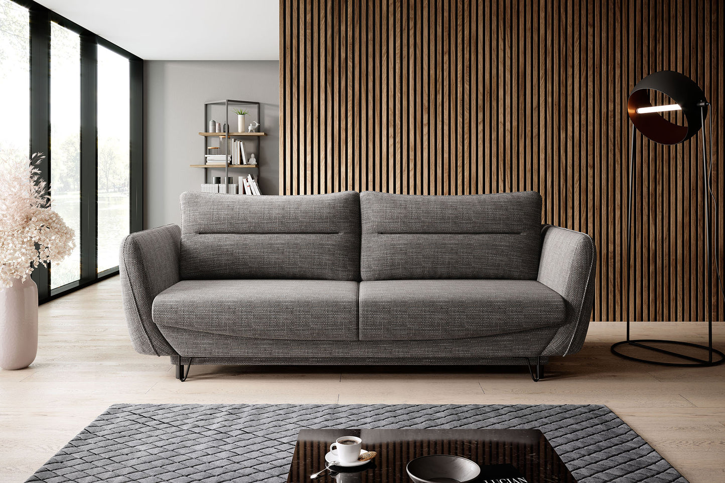 Nowoczesna sofa Silva w tkaninie Marte 130 szary, z dużymi poduszkami oparciowymi, szerokimi bokami oraz smukłymi czarnymi nóżkami, idealna do rodzinnej strefy relaksu.