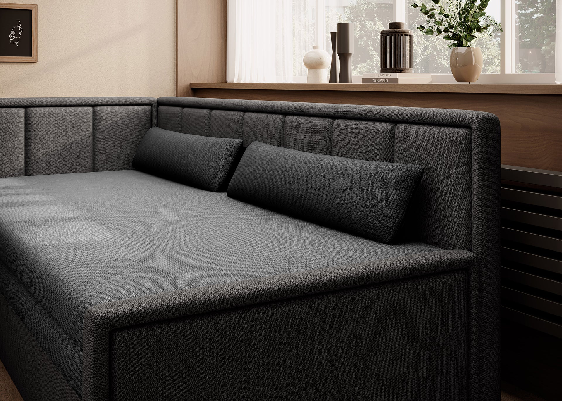 Czarna sofa tapicerowana z poduszkami i oparciem narożnym – elegancja w prostym stylu.