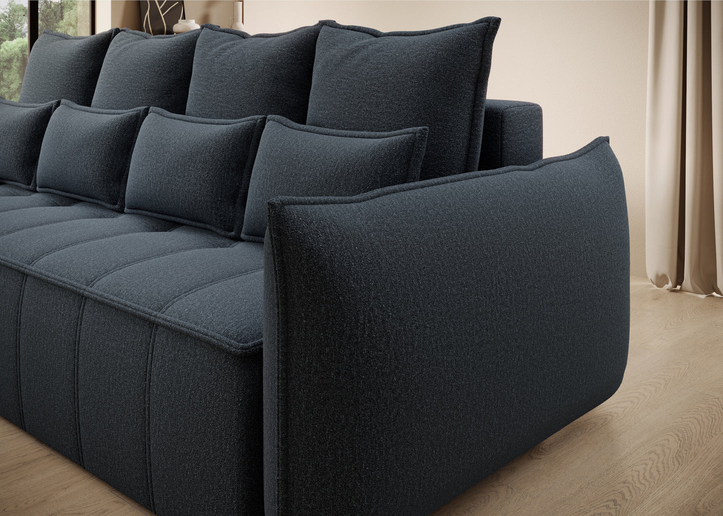 Widok z boku na kanapę Weltton w tkaninie Enjoy 40 granatowy – zaokrąglone podłokietniki i elegancki design.