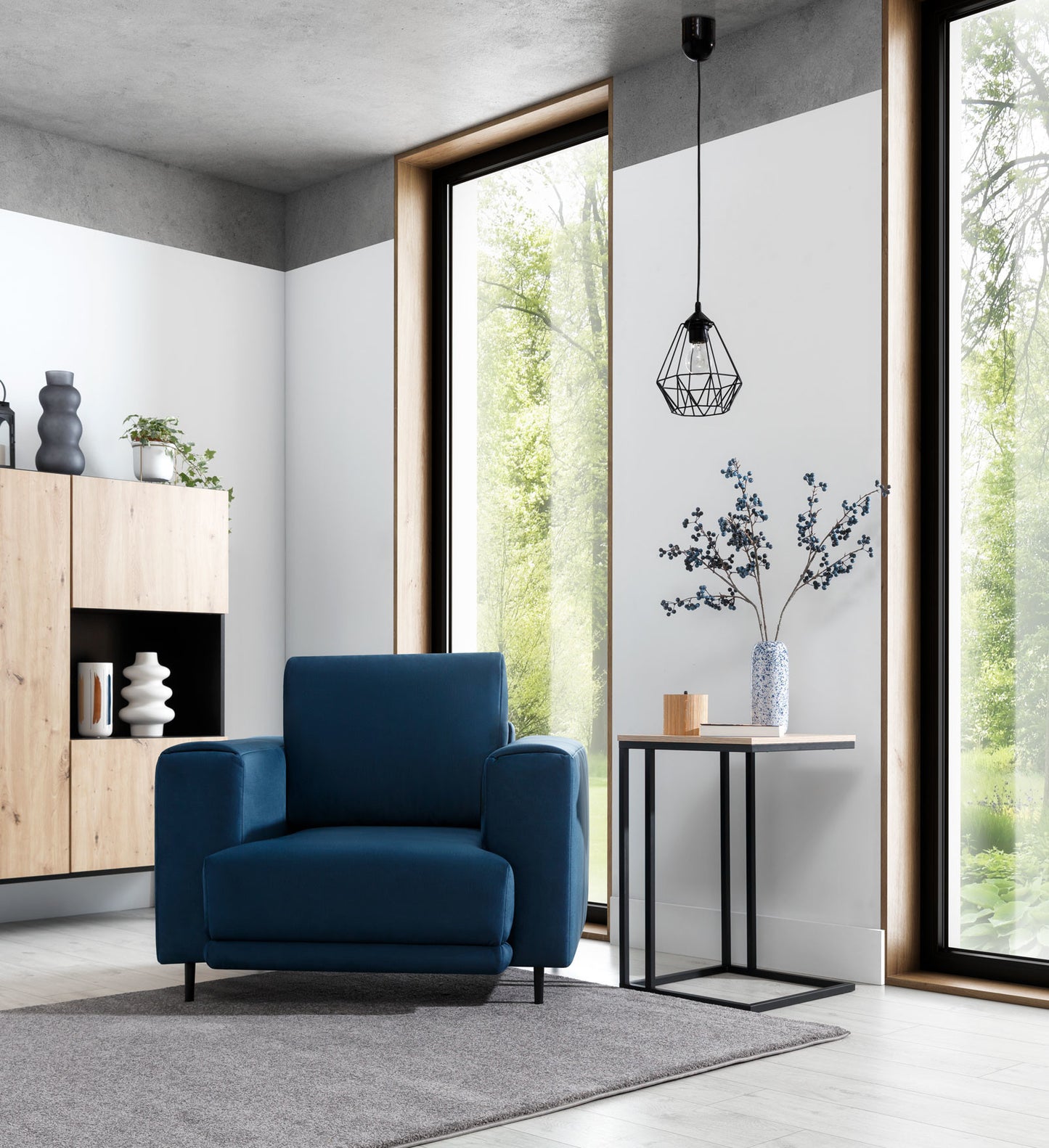 Lampa wisząca Bendinni czarna 19x110 cm w aranżacji wnętrza – pojedynczy zwis w nowoczesnym salonie