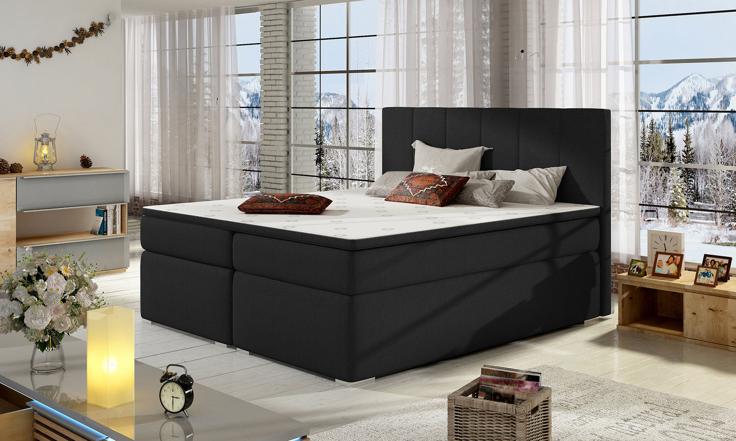 Łóżko Bolero 140x200 Sawana 14 czarny w eleganckiej sypialni z dużymi oknami i górskim widokiem.