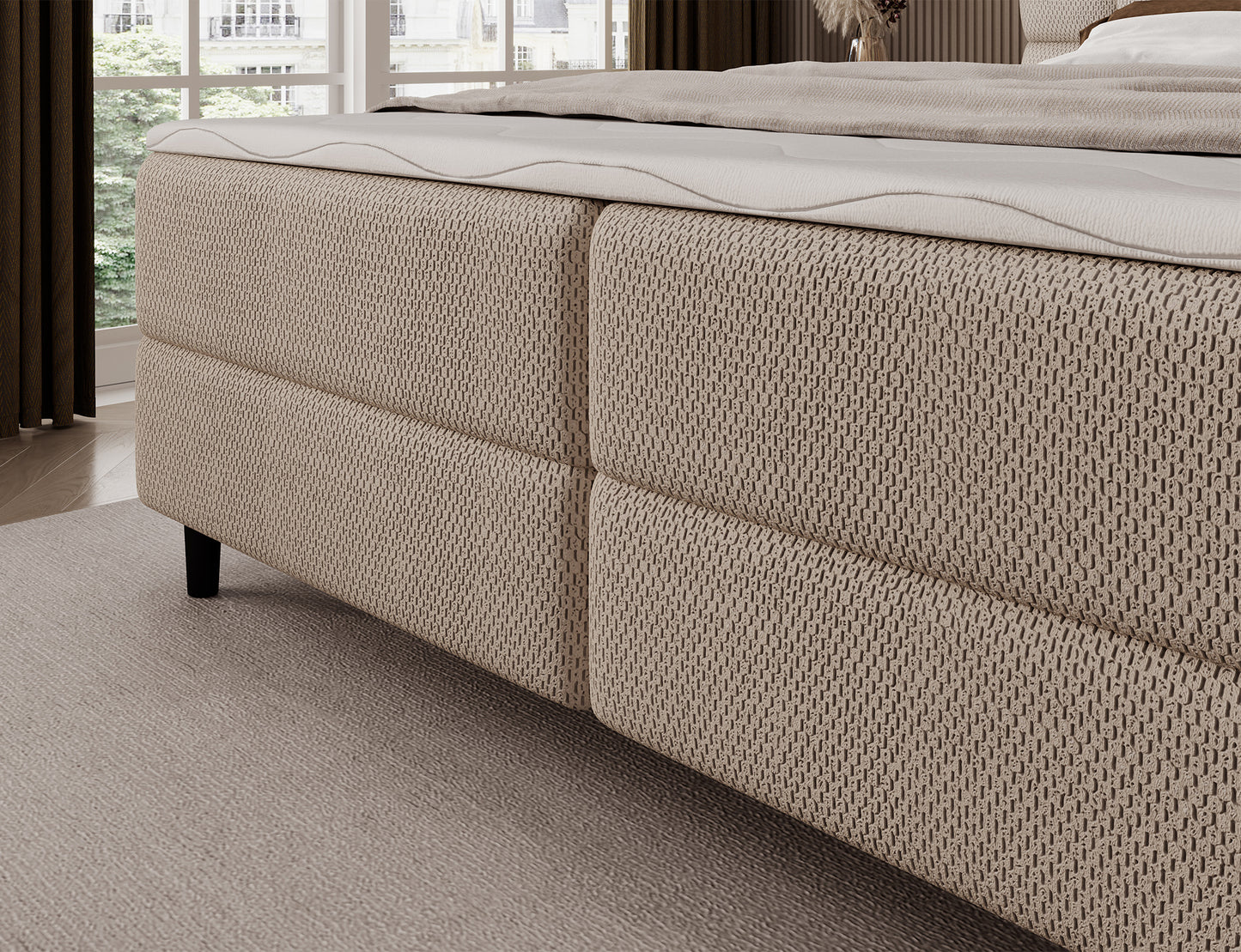 Korpus łóżka kontynentalnego Camma Calmora 18 w beżowej tkaninie, stabilna podstawa na czarnych, eleganckich nogach