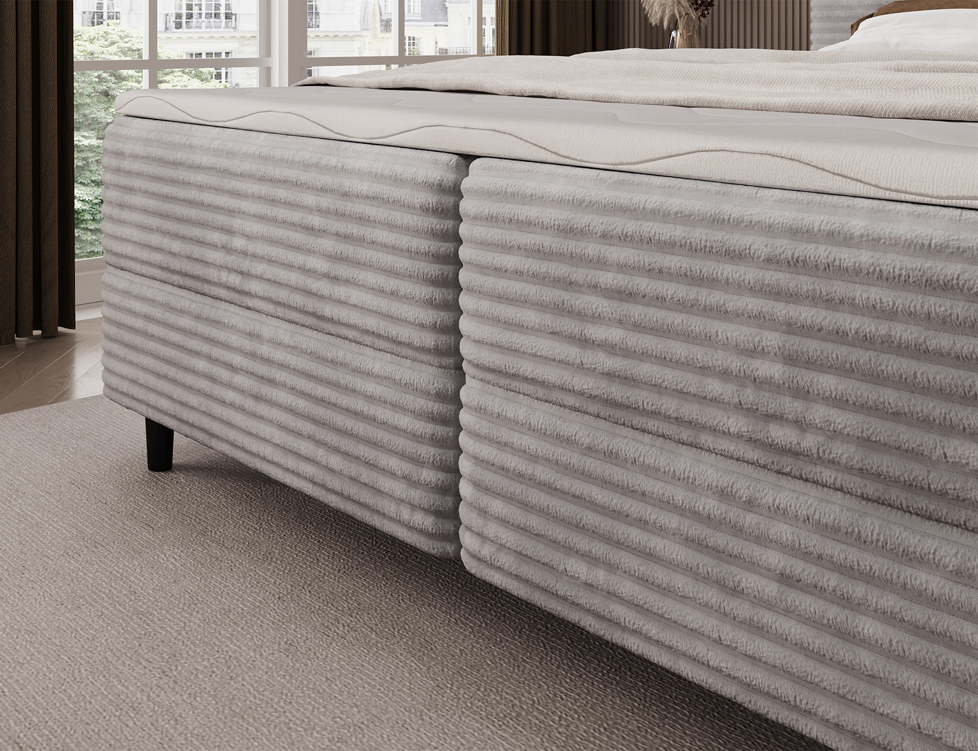 Korpus łóżka Cortiko ELTAP w tkaninie Modullo 03, jasnoszary odcień, eleganckie wykończenie i czarne nogi na tle jasnej podłogi