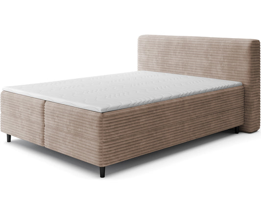 Beżowe łóżko kontynentalne Cortiko ELTAP w tkaninie Modullo 20, ujęcie skośne na białym tle z widocznym zagłówkiem i czarnymi nogami