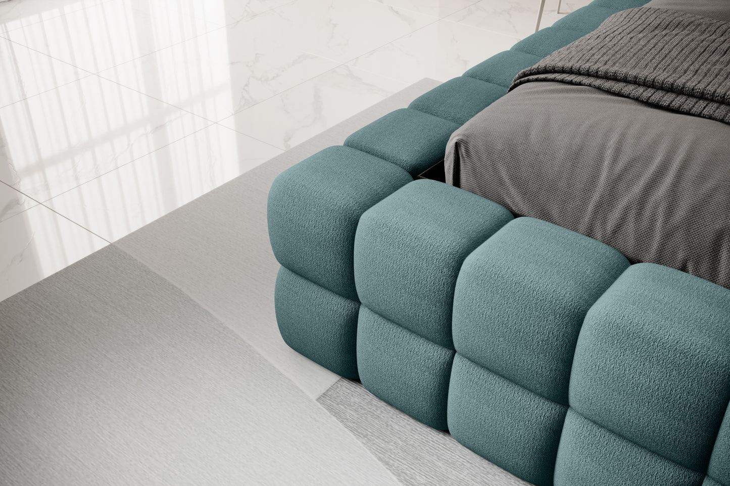 Detal narożnika łóżka Dizzle 140x200 cm w tkaninie Amore 38 turkusowy, ukazujący miękkie tapicerowane wykończenie w stylowym wnętrzu.