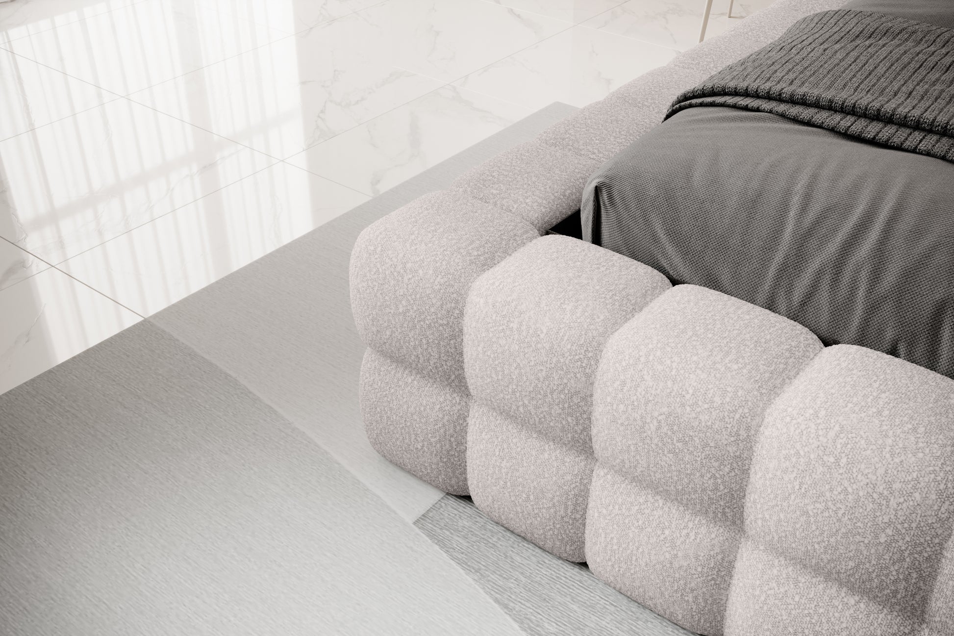 Detal narożnika łóżka Dizzle 160x200 cm w tkaninie Jaffray 03 szary, ukazujący miękkie, tapicerowane wykończenie w stylowym, minimalistycznym wnętrzu.