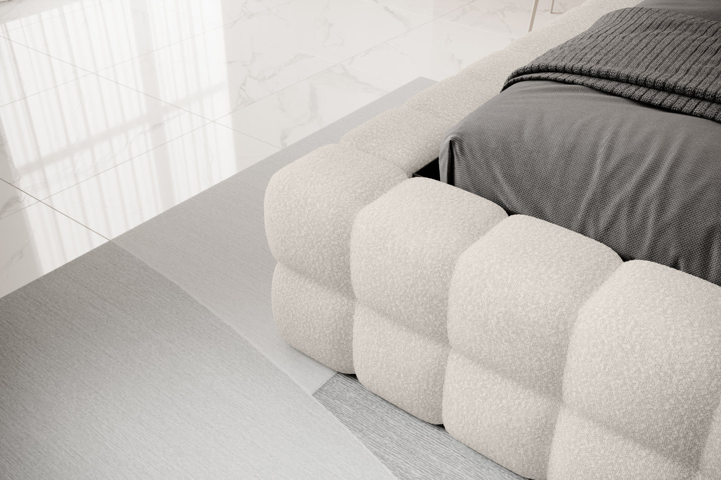 Detal narożnika łóżka Dizzle 180x200 cm w tkaninie Jaffray 18 jasnobeżowy, ukazujący miękkie, tapicerowane wykończenie w stylowym, minimalistycznym wnętrzu.