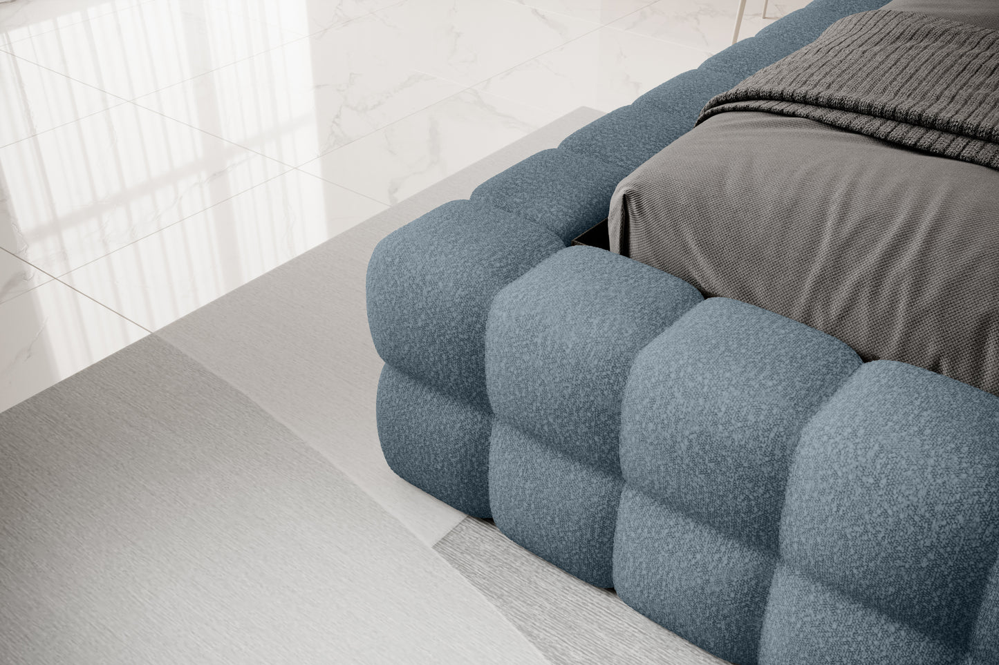 Detal narożnika łóżka Dizzle 160x200 cm w tkaninie Jaffray 40 niebieski, ukazujący miękkie, tapicerowane wykończenie w stylowym, minimalistycznym wnętrzu.