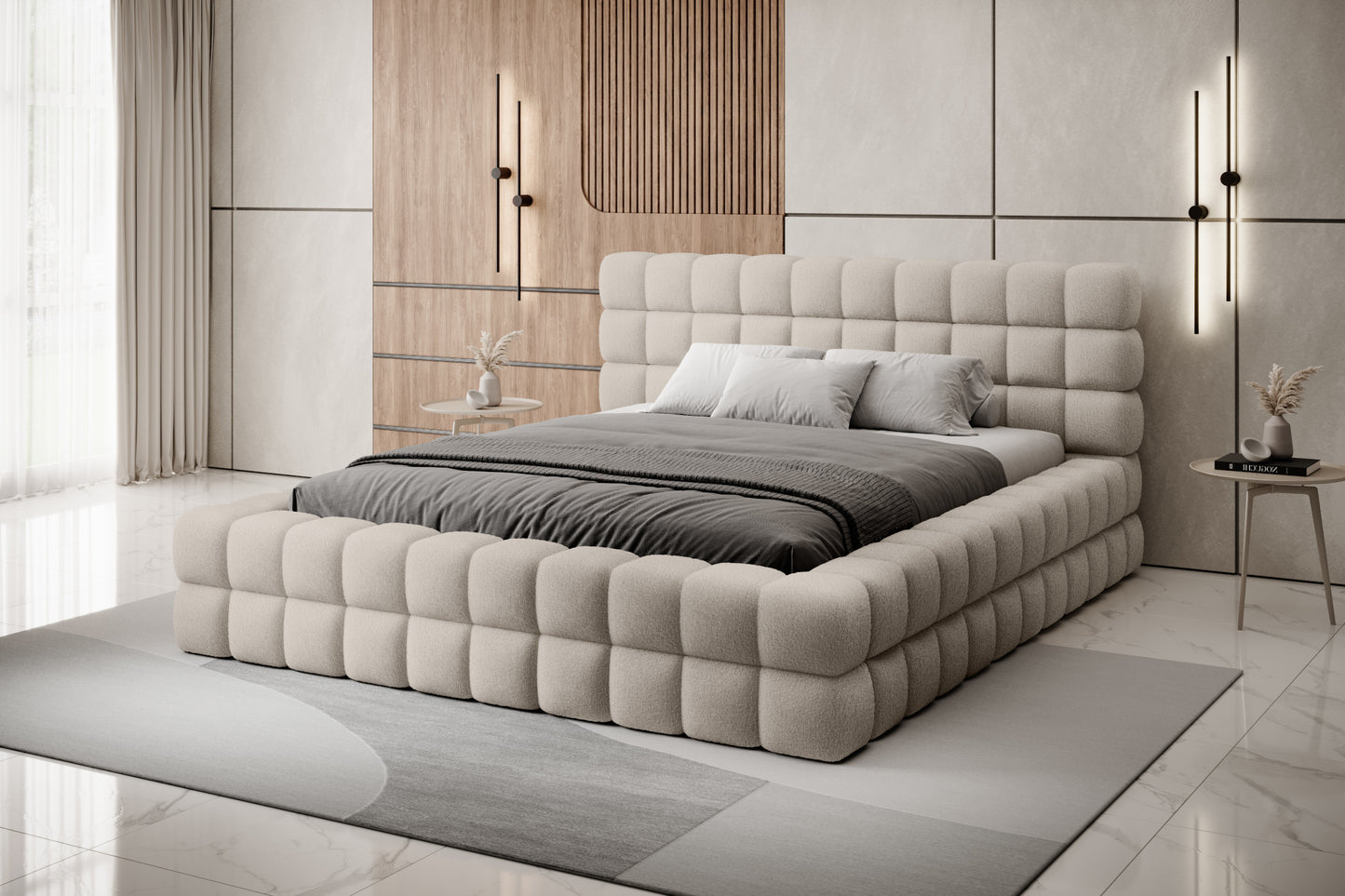 Łóżko Dizzle 180x200 cm w kolorze Royal 18 beżowy ustawione w eleganckiej, jasnej sypialni z drewnianymi akcentami i designerskim oświetleniem.