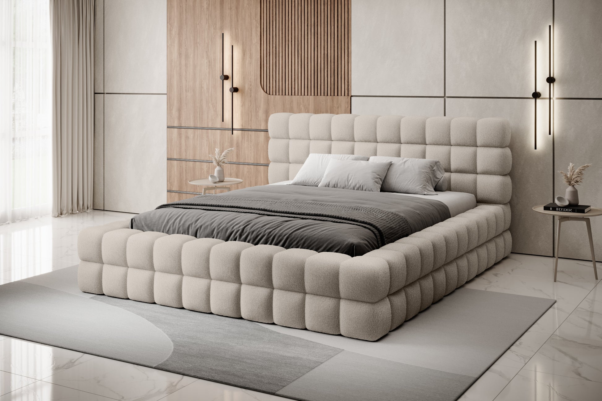 Łóżko Dizzle 180x200 cm w kolorze Royal 18 beżowy ustawione w eleganckiej, jasnej sypialni z drewnianymi akcentami i designerskim oświetleniem.