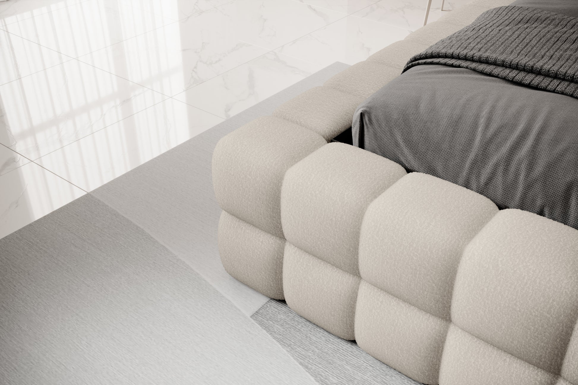 Detal narożnika łóżka Dizzle 180x200 cm w tkaninie Royal 20 beżowy, ukazujący miękkie, tapicerowane wykończenie w stylowym, minimalistycznym wnętrzu.