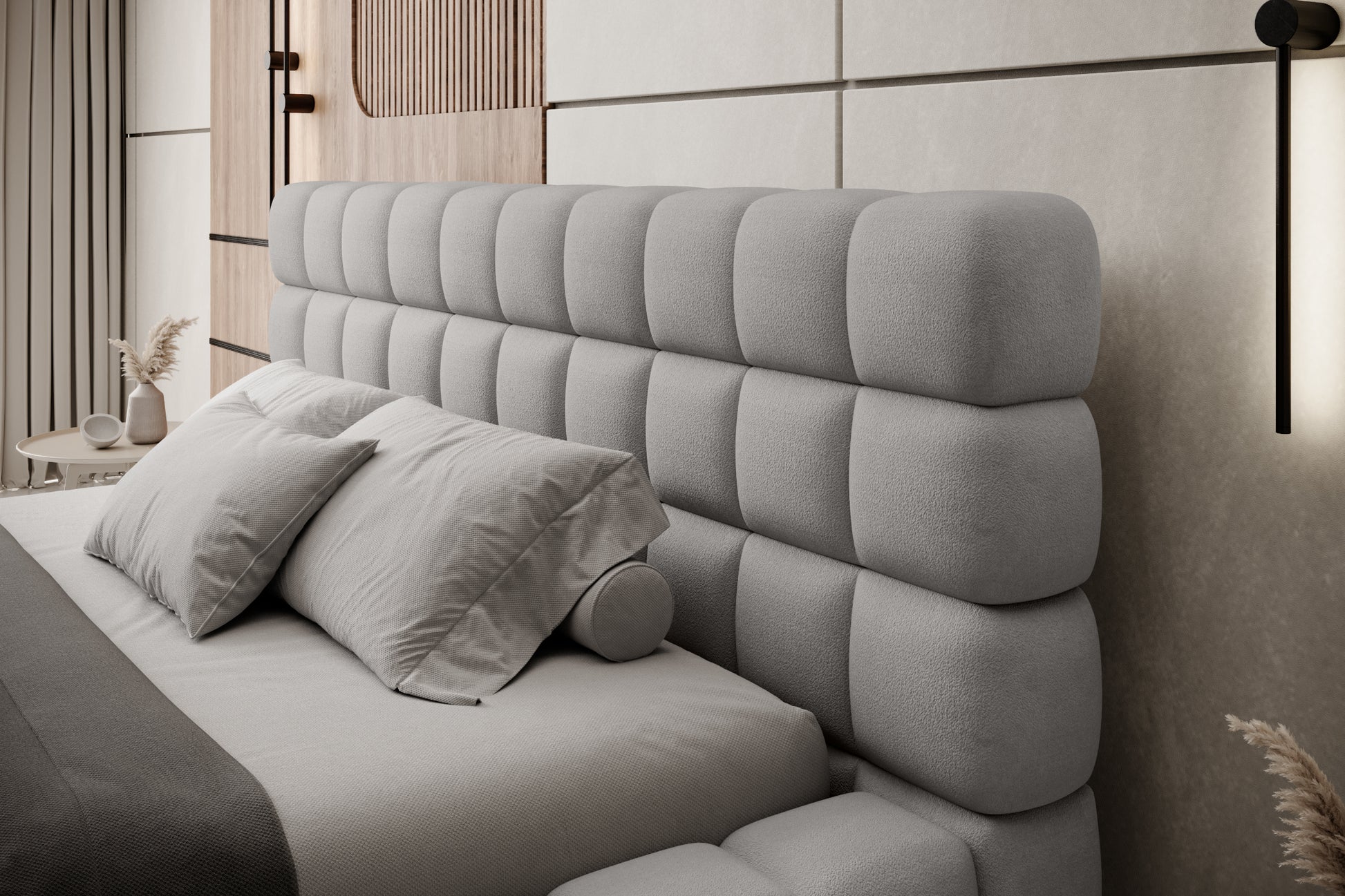 Zbliżenie na pikowany zagłówek łóżka Dizzle 160x200 cm w tkaninie Touch 03 jasnoszary, udekorowany eleganckimi poduszkami w nowoczesnej aranżacji sypialni.