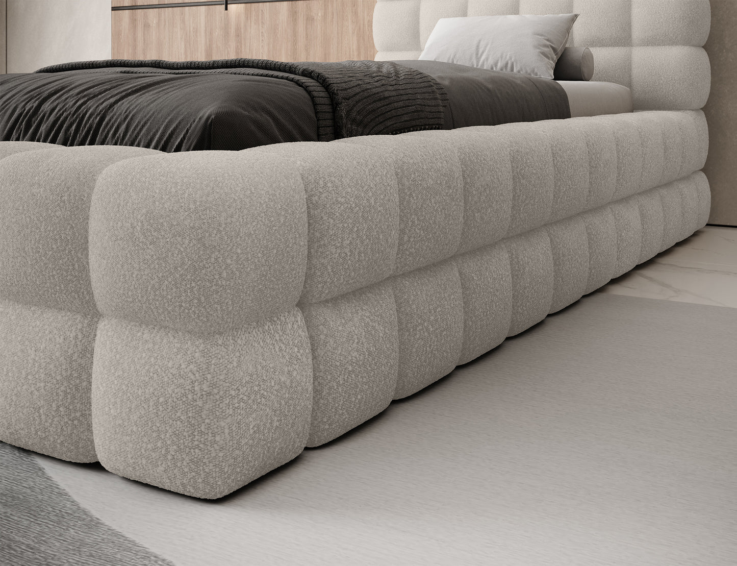 Zbliżenie na bok łóżka Dizzle 90 w tkaninie Jaffray 18 jasnobeżowy, wyraźnie widoczne duże pikowania tapicerki.