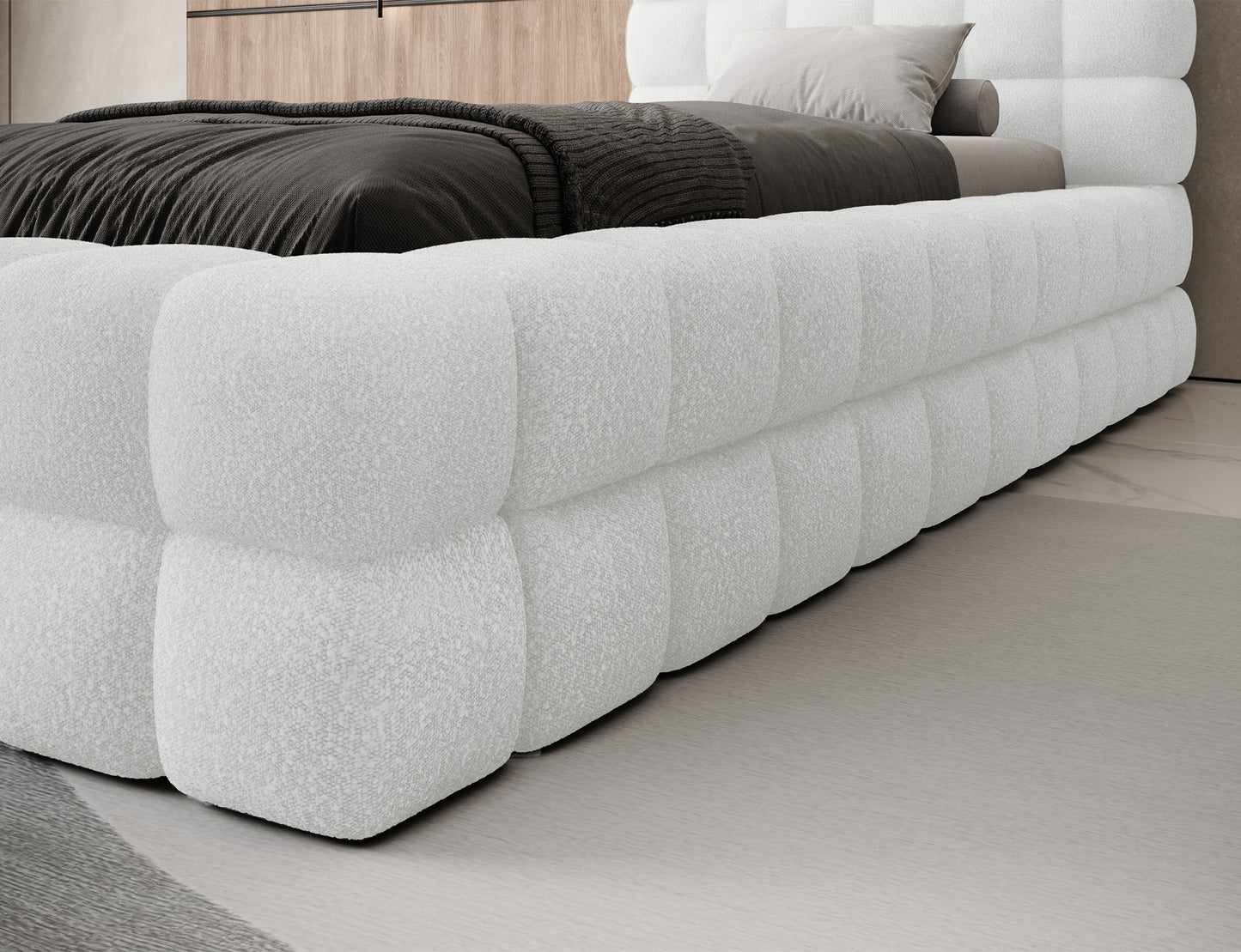 Detal narożnika łóżka Dizzle I 90x200 w tkaninie Royal 01 biały, miękka tapicerka o wyrazistej fakturze bouclé.