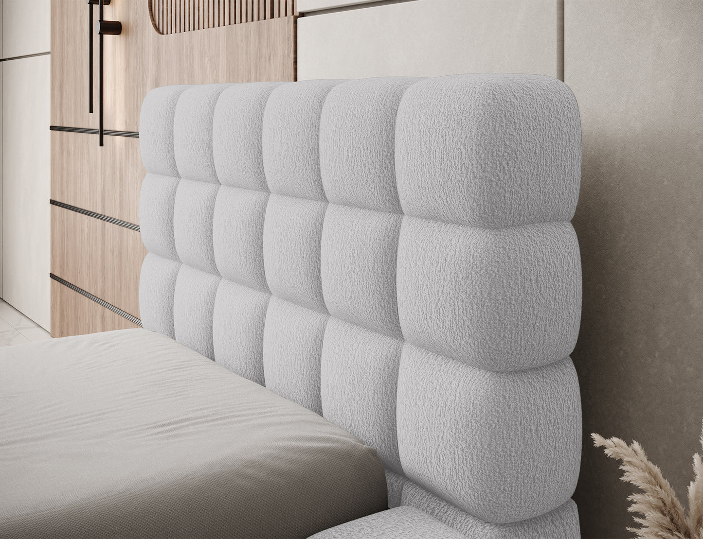 Detal zagłówka łóżka Dizzle I 90x200 cm w tkaninie Royal 04 szary, miękka tapicerka i stylowe, geometryczne pikowanie.