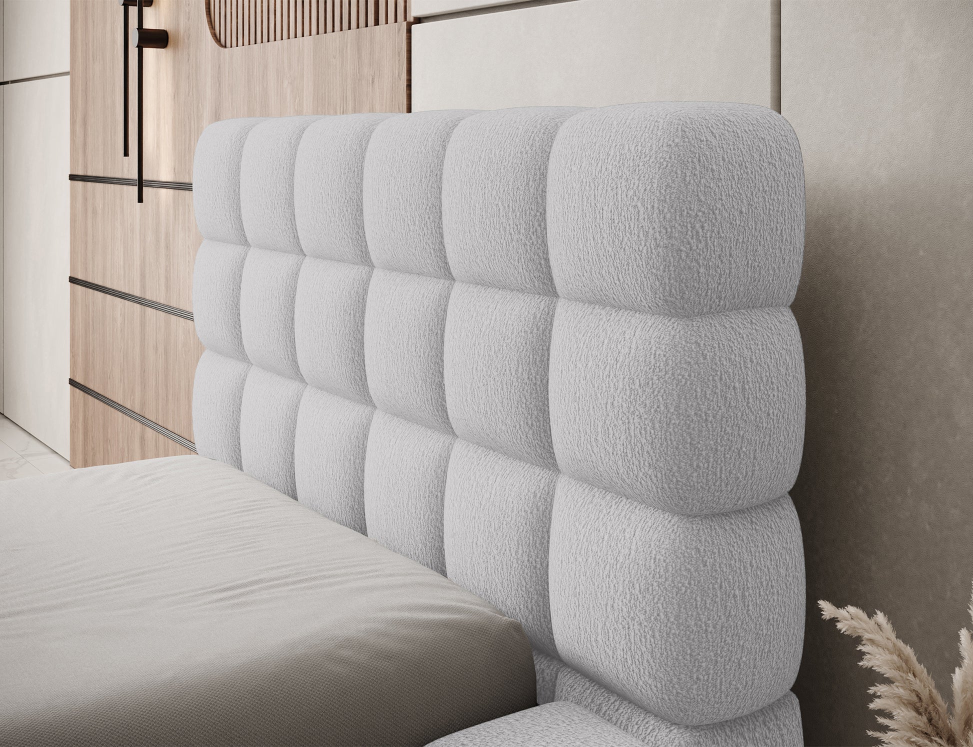 Detal zagłówka łóżka Dizzle I 90x200 cm w tkaninie Royal 04 szary, miękka tapicerka i stylowe, geometryczne pikowanie.