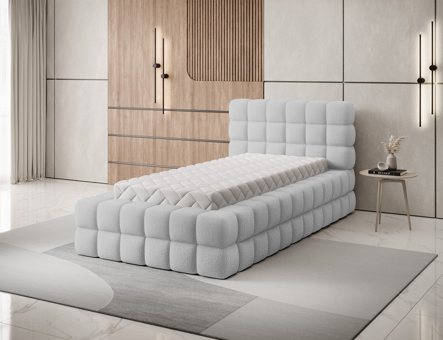 Łóżko Dizzle I 90x200 cm w tkaninie Royal 04 szary, widok na materac i miękko tapicerowany korpus z geometrycznym szyciem.