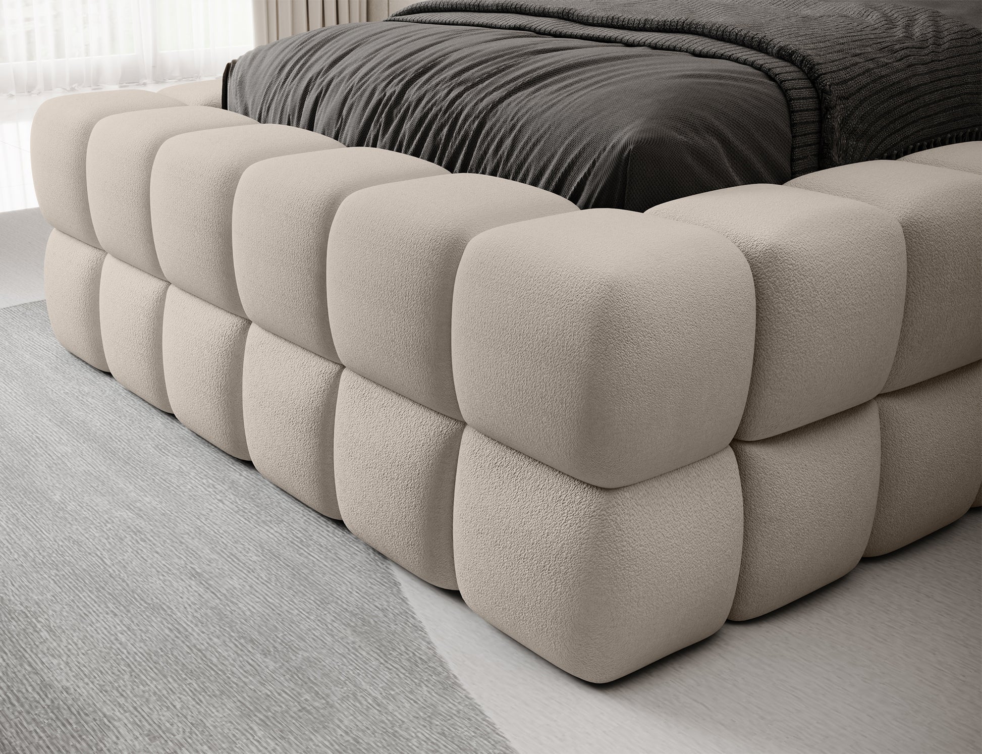 Detal narożnika łóżka Dizzle 90 Touch 18 jasnobeżowy – miękkie pikowania, staranne szycie i designerska forma mebla.