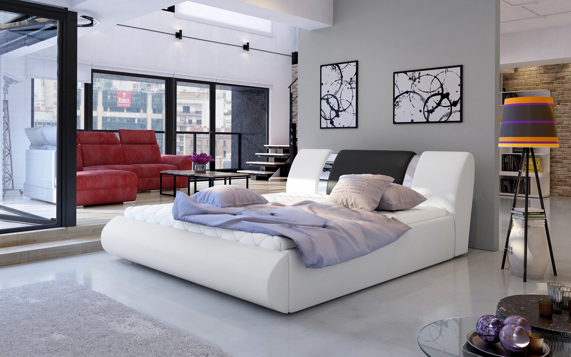 Łóżko Flavio 180x200 cm w kolorze Soft 17 biały / Soft 11 czarny ustawione w przestronnej, nowoczesnej sypialni z dużymi oknami i minimalistycznymi dodatkami.
