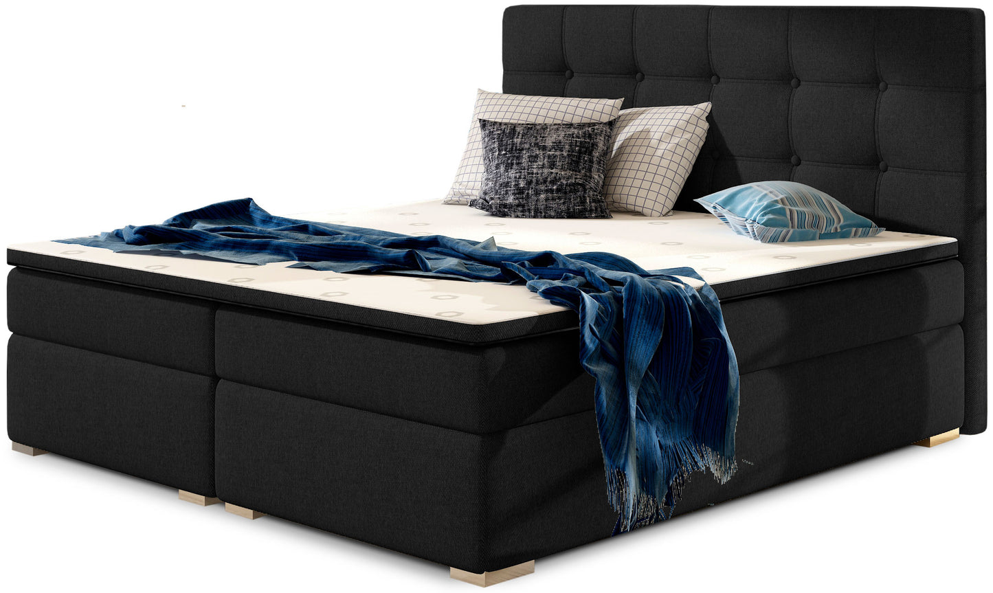 Łóżko kontynentalne Inez 180x200 cm w kolorze Sawana 14 czarny, z eleganckim tapicerowanym zagłówkiem pikowanym w kwadraty.