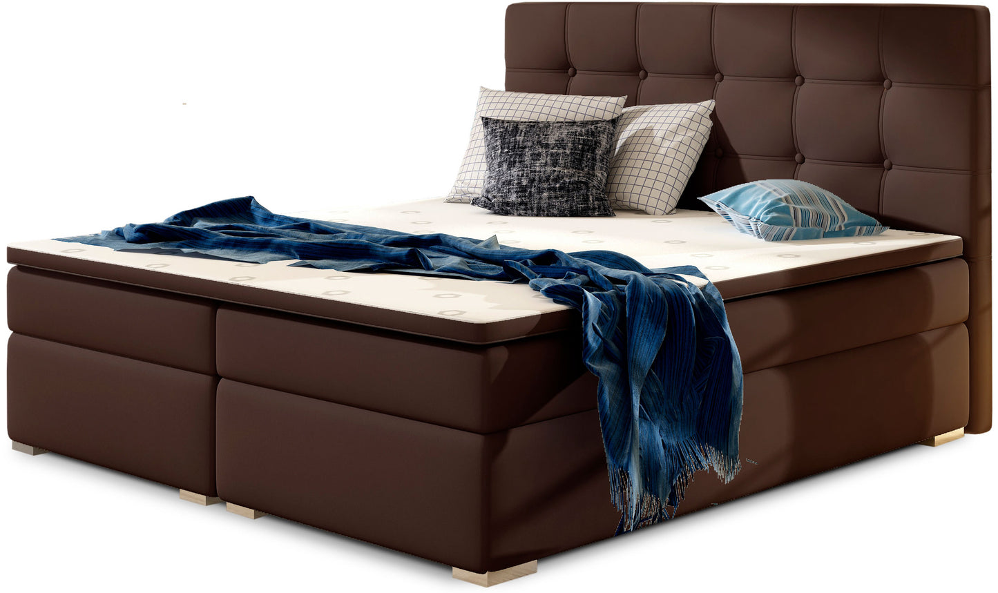 Łóżko kontynentalne Inez 160x200 cm w kolorze Soft 66 brązowy, z tapicerowanym pikowanym zagłówkiem i eleganckim wykończeniem.