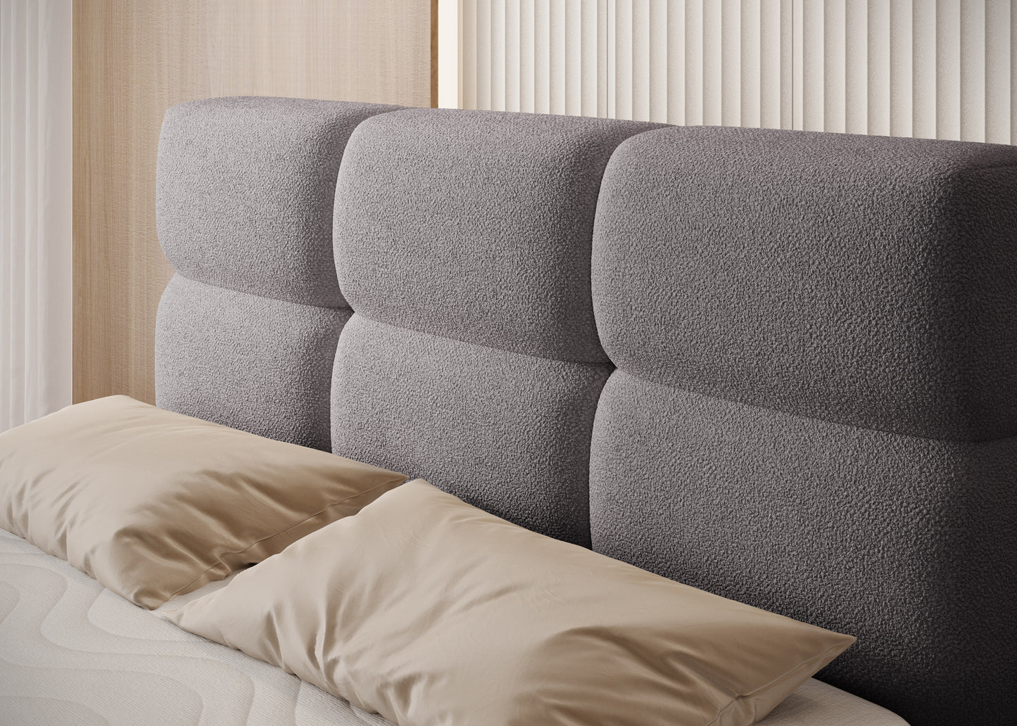 Zbliżenie na zagłowie łóżka Kasped w tkaninie Paolli 04 szarej, miękkie przeszycia i tapicerowane panele w eleganckim stylu.