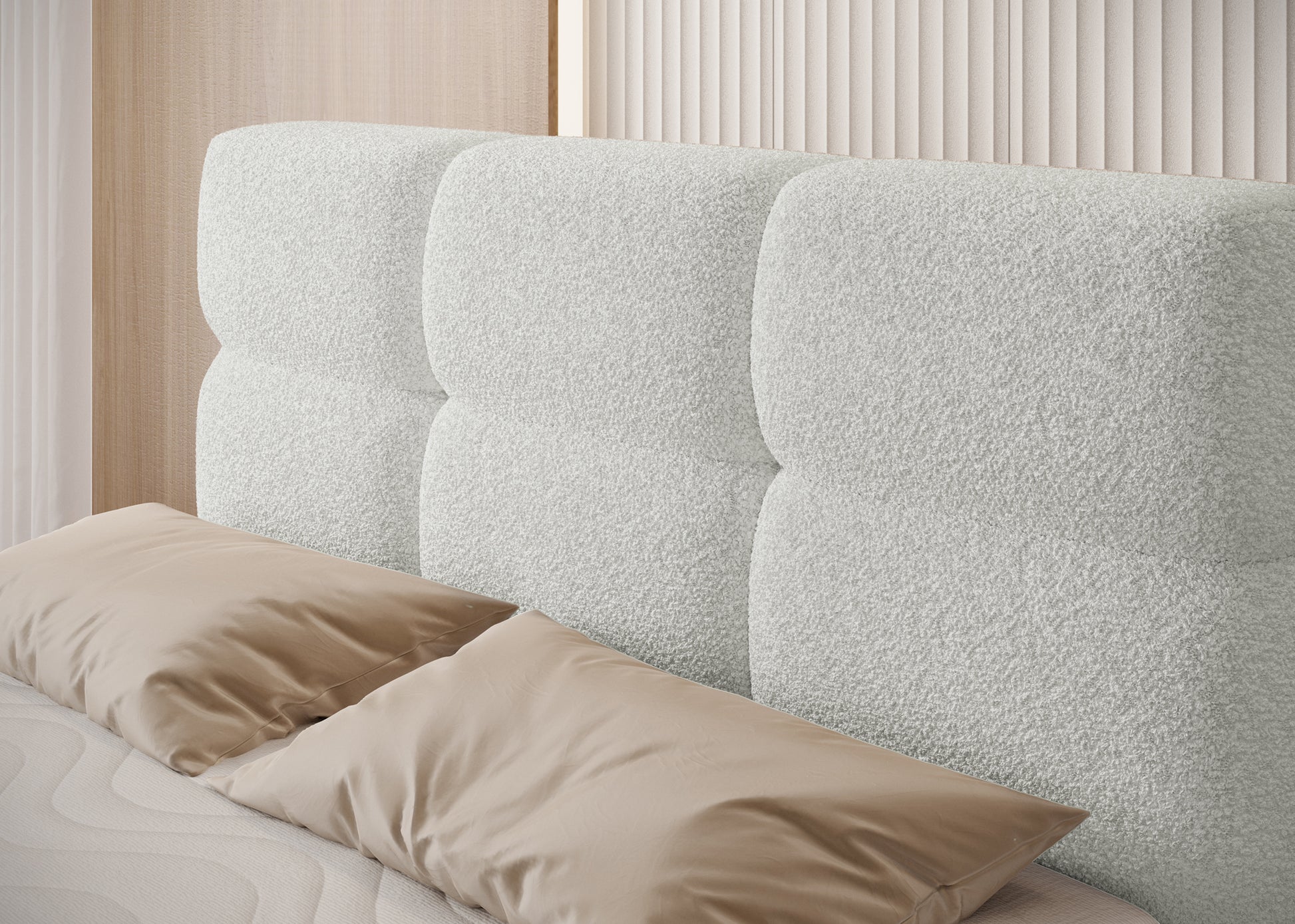 Detal zagłówka łóżka Kasped w tkaninie Royal 01 białej, miękkie przeszycia i eleganckie panele tapicerowane w nowoczesnym stylu.