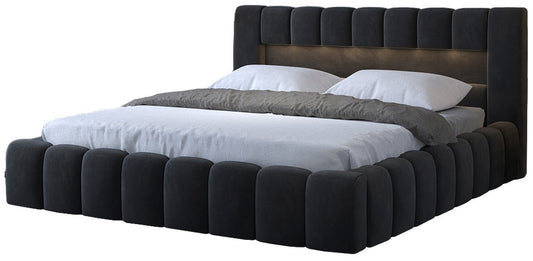 Łóżko tapicerowane Lamica 160x200 cm w kolorze Monolith 85 szary, widok z przodu pod kątem, z miękkim wezgłowiem i pikowanym bokiem.