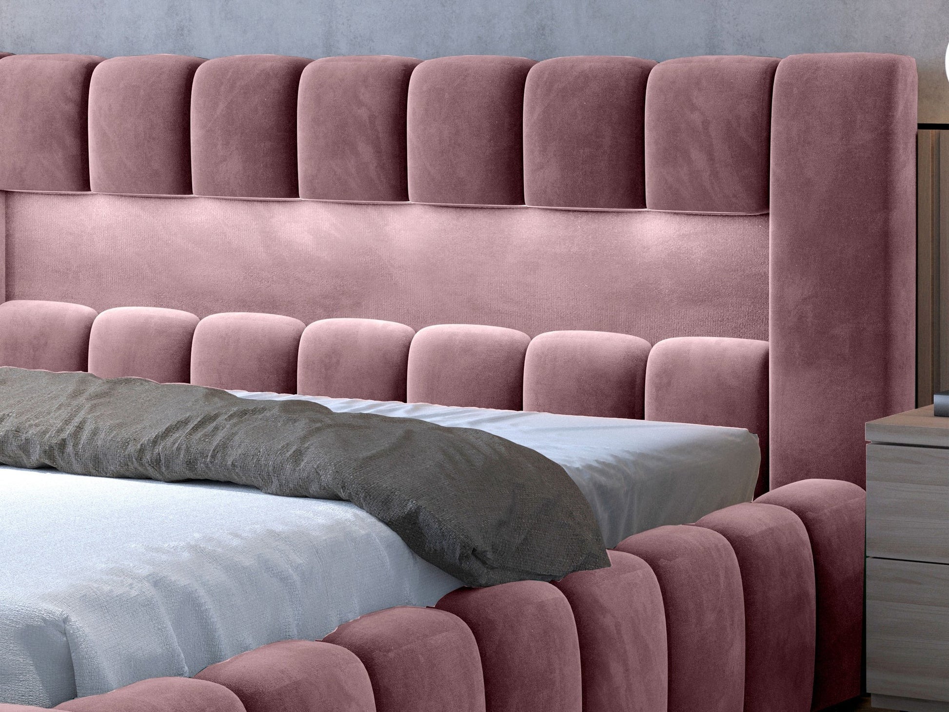 Detal zagłówka łóżka Lamica w odcieniu Monolith 63 różowy z oświetleniem LED.