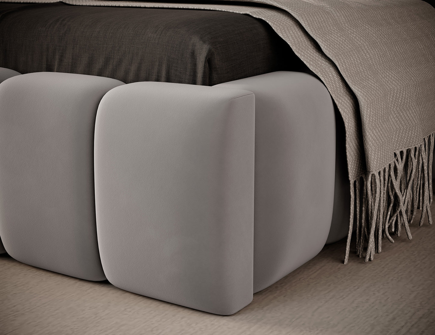 Zbliżenie narożnika dolnej części łóżka Lamica I Nube 03, pokazujące staranne wykończenie szwów i miękkie pikowanie.