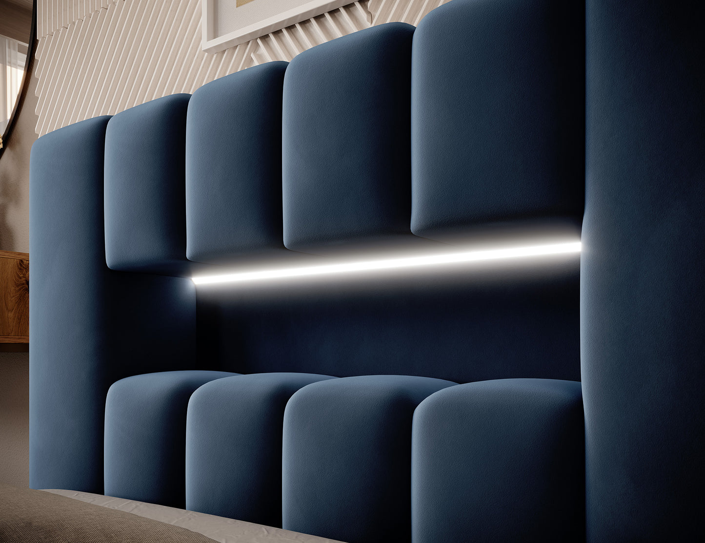 Zbliżenie na wezgłowie łóżka Lamica I Nube 40 z wbudowanym subtelnym paskiem LED i pikowanymi, wypukłymi panelami tapicerki.