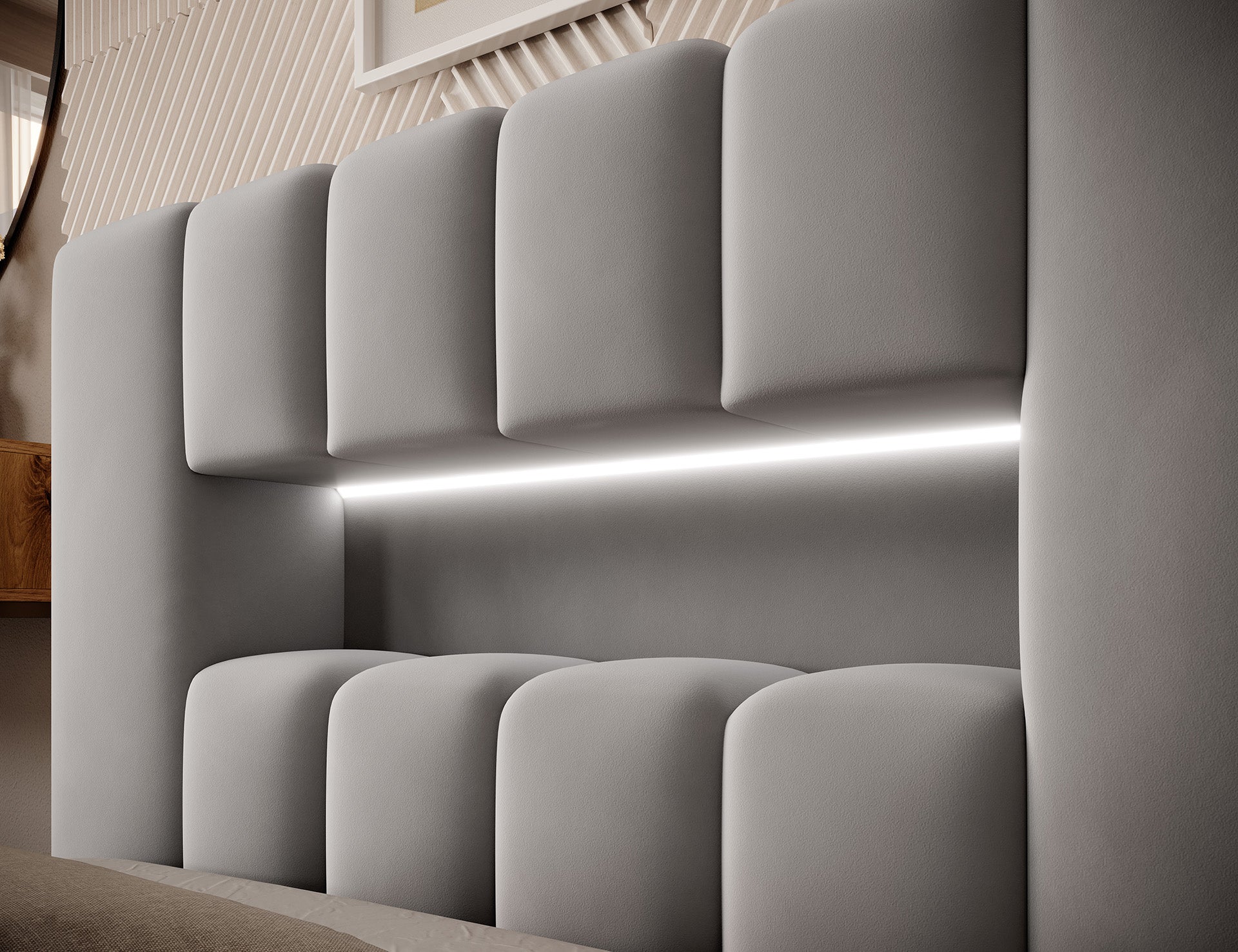 Zbliżenie na wezgłowie Lamica I Nube 45 z wbudowanym paskiem podświetlenia LED oraz wypukłymi, pionowymi panelami tapicerki.
