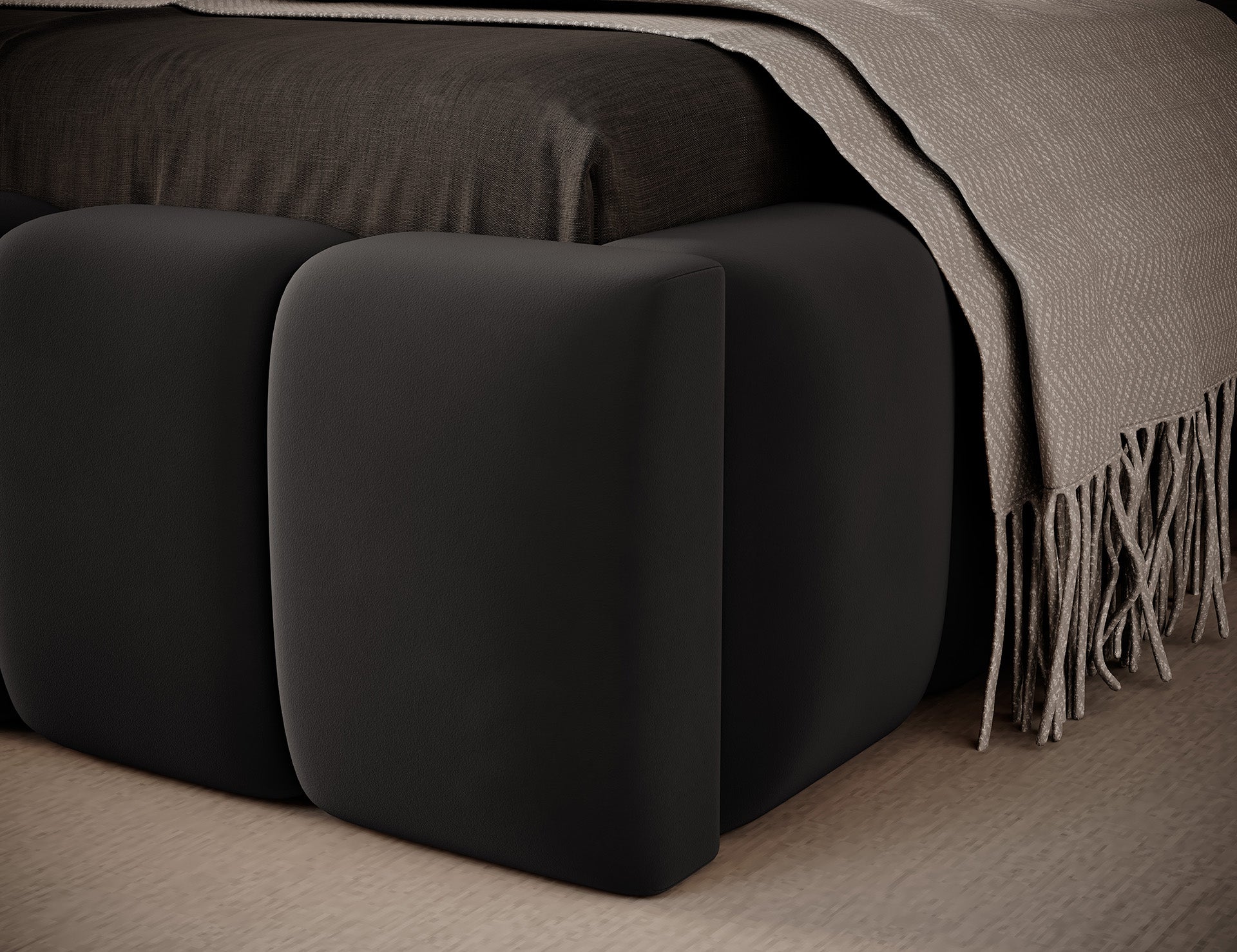 Zbliżenie dolnego narożnika łóżka Lamica I Nube 06 ciemnoszary (90×200 cm) z widoczną fakturą tkaniny i narzutą na materacu.