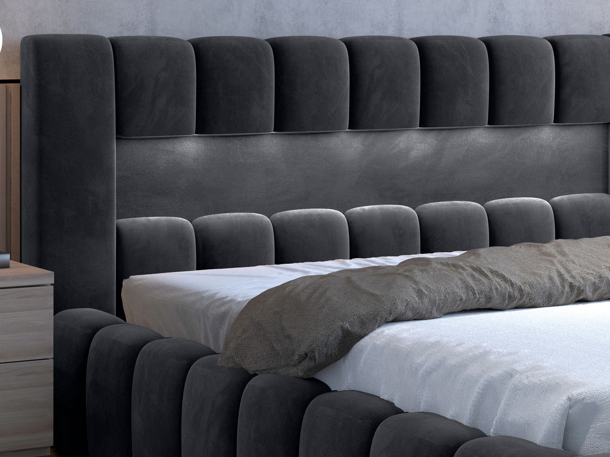 Detal górnej części zagłówka i welurowej tapicerki łóżka Lamica II Monolith 85 szary.