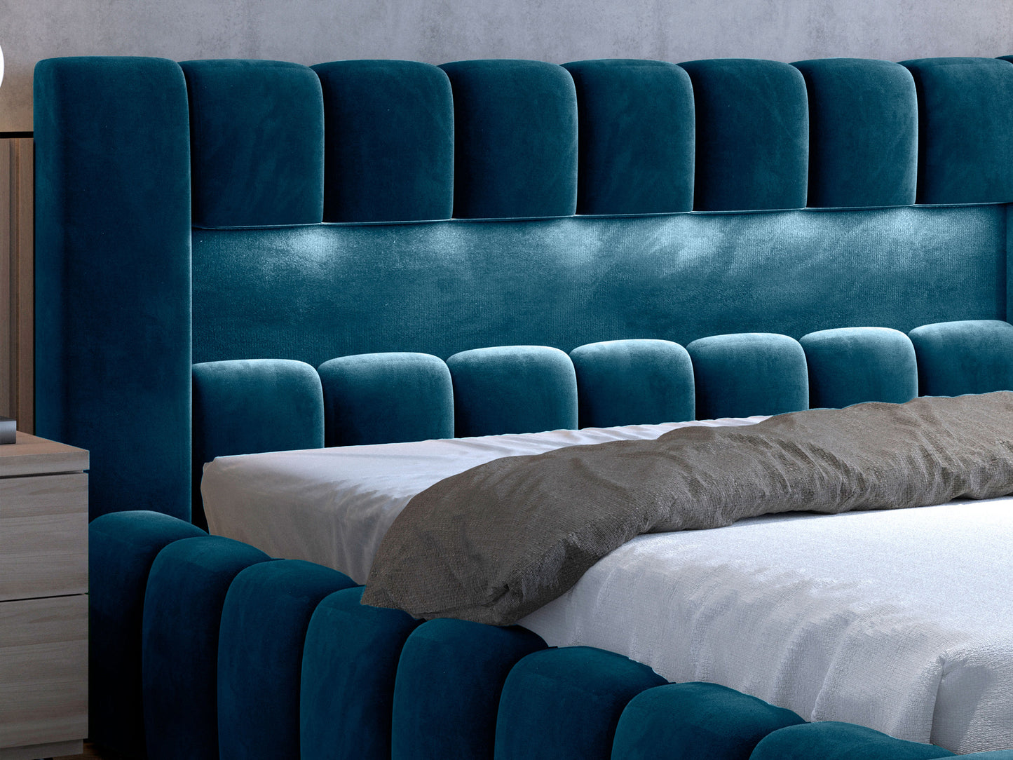 Zbliżenie na zagłówek i boczne obicie łóżka Lamica II granatowego, widok z boku.