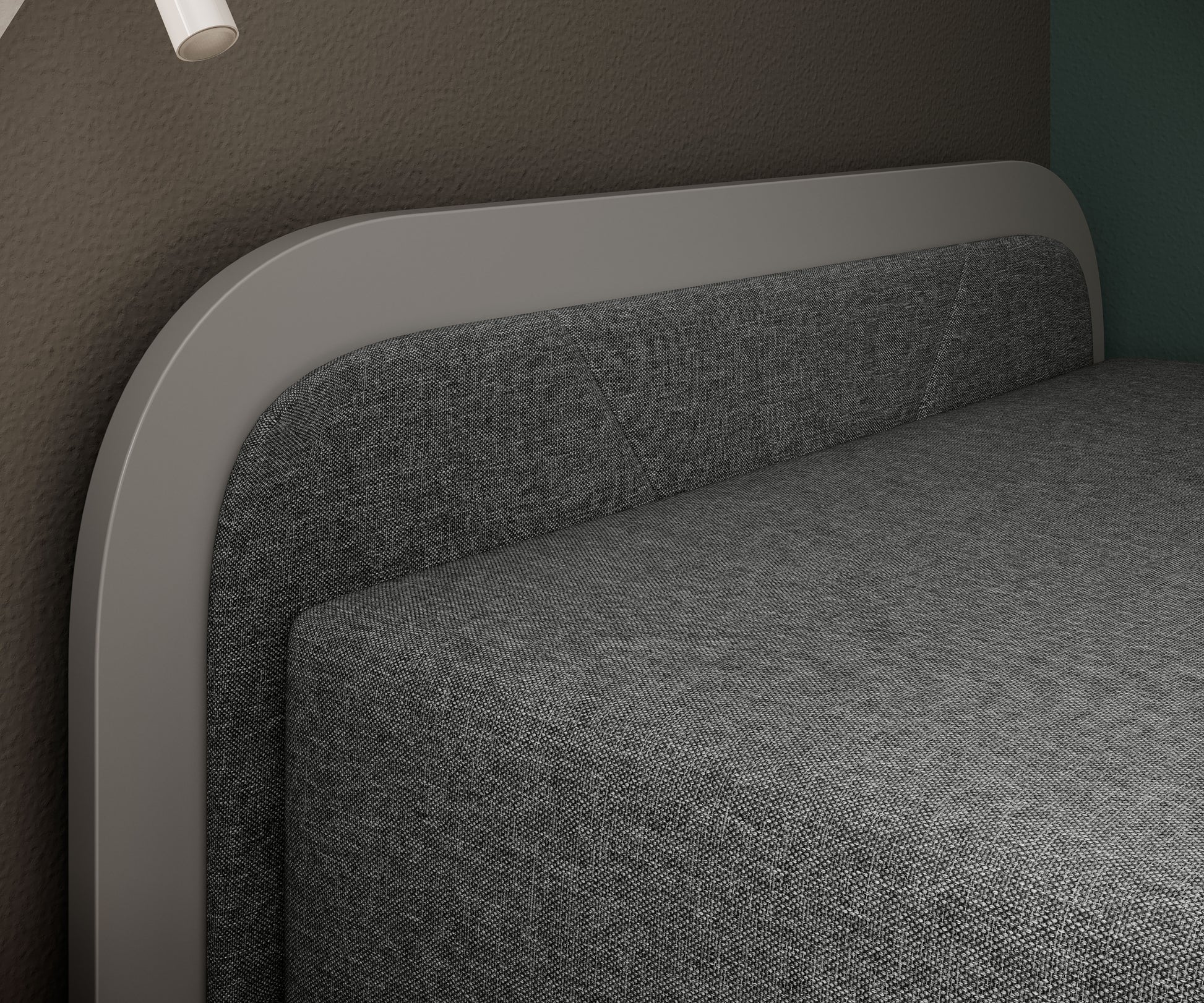 Tapicerowany zagłówek łóżka Parys I Sawana 21 (szary) w układzie lewym, widok z bliska na detal szarej tkaniny i zaokrąglonej ramy.