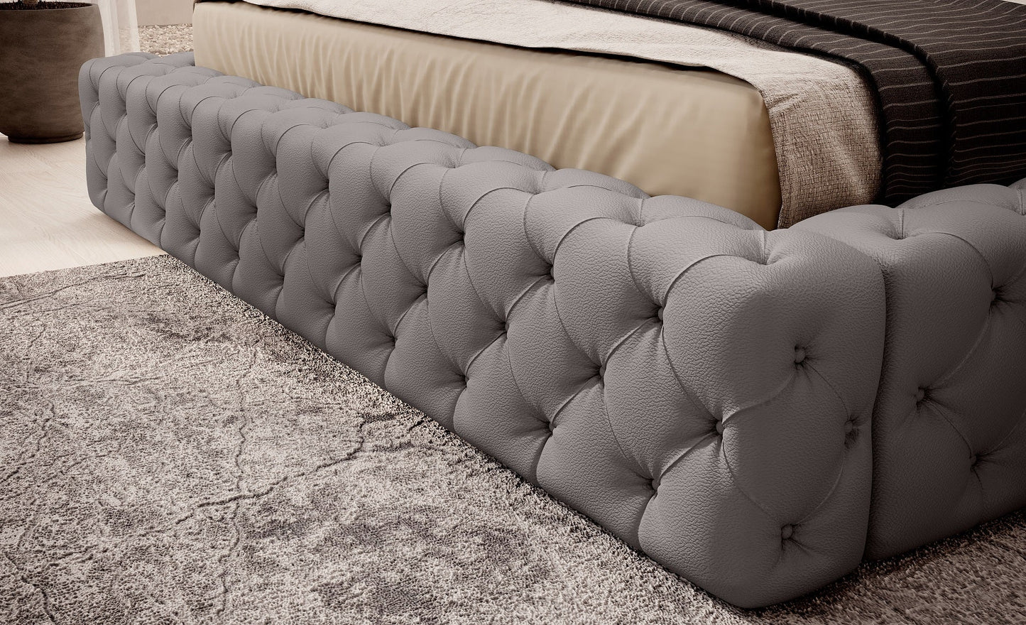 Dolna część łóżka Princce 180x200 Softis 29 szary z pikowanym obiciem i beżową narzutą.