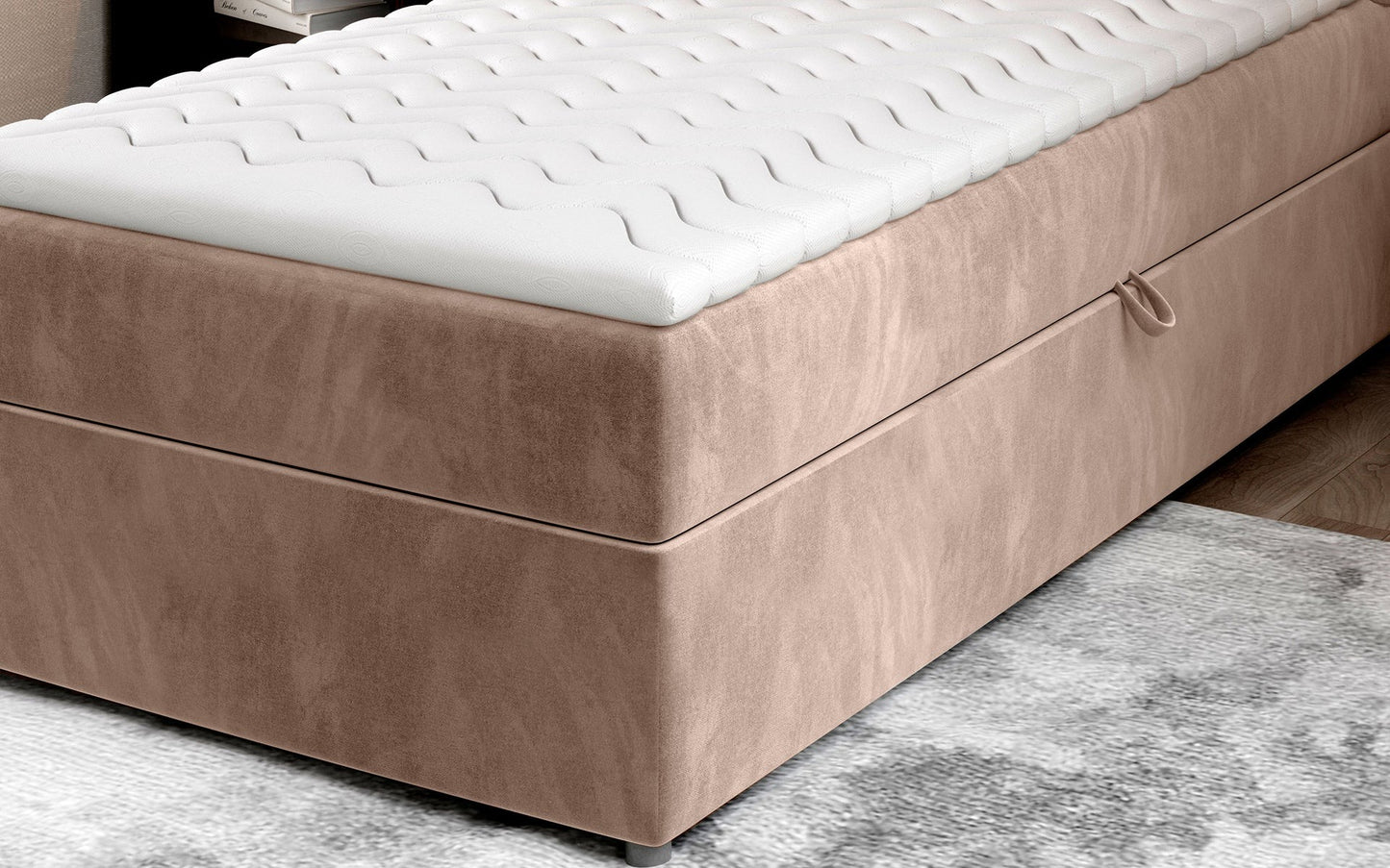 Zbliżenie na dolną część łóżka Rivia w kolorze Monolith 09 jasnobrązowy o wymiarach 90x200 cm, z widocznym pojemnikiem na pościel.