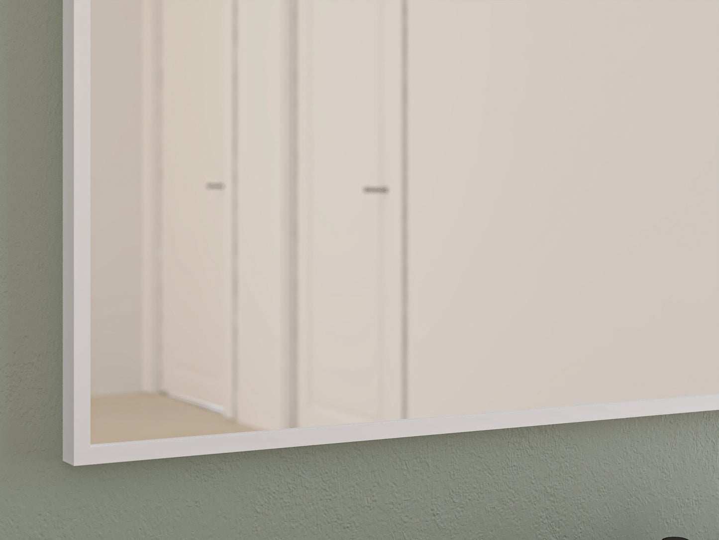 Lustro ścienne Fellan 60×70 cm – detal dolnej części przy ścianie