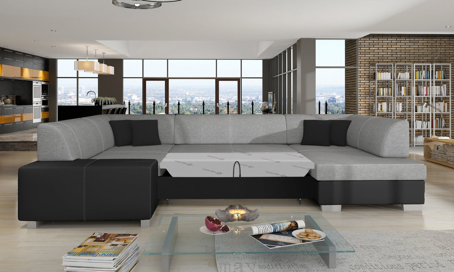 Narożnik Havana Sawana 21 szary z czarnymi wykończeniami Soft 11, modułowa sofa prezentowana w przestronnym salonie