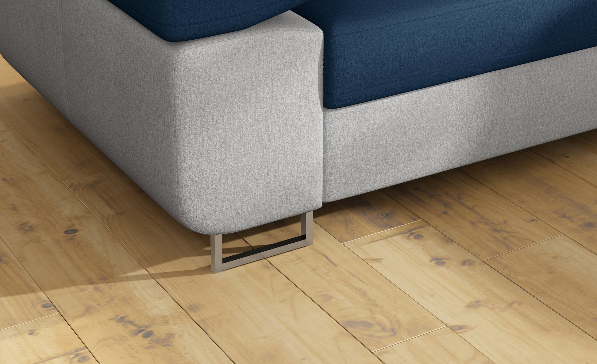 Detal metalowej nóżki narożnika Anton Monolith 77 niebieski / Monolith 84 jasnoszary.