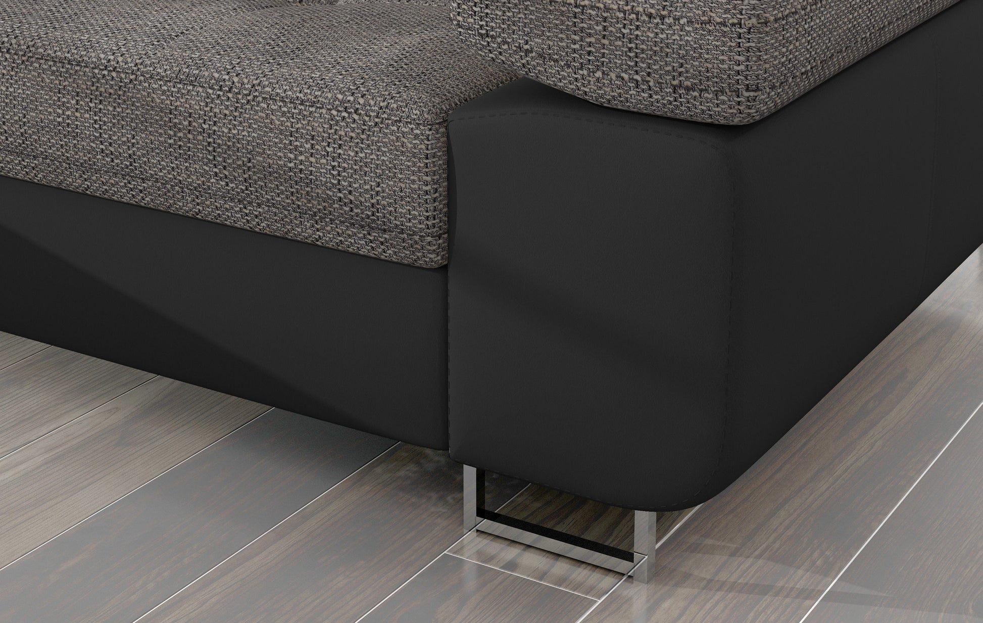 Detal narożnika Armando: szara tkanina Berlin 01 połączona z czarną podstawą Soft 11 – widok narożnika z metalową nogą.