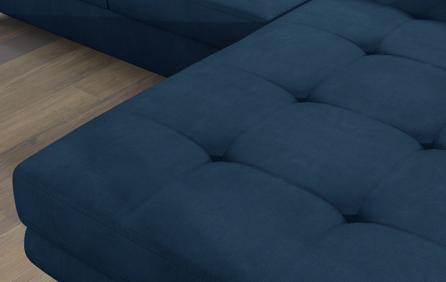 Zbliżenie na pikowane siedzisko narożnika Armando w tkaninie Kronos 09 granatowy – widoczna aksamitna struktura i poduszka Botanical 80.