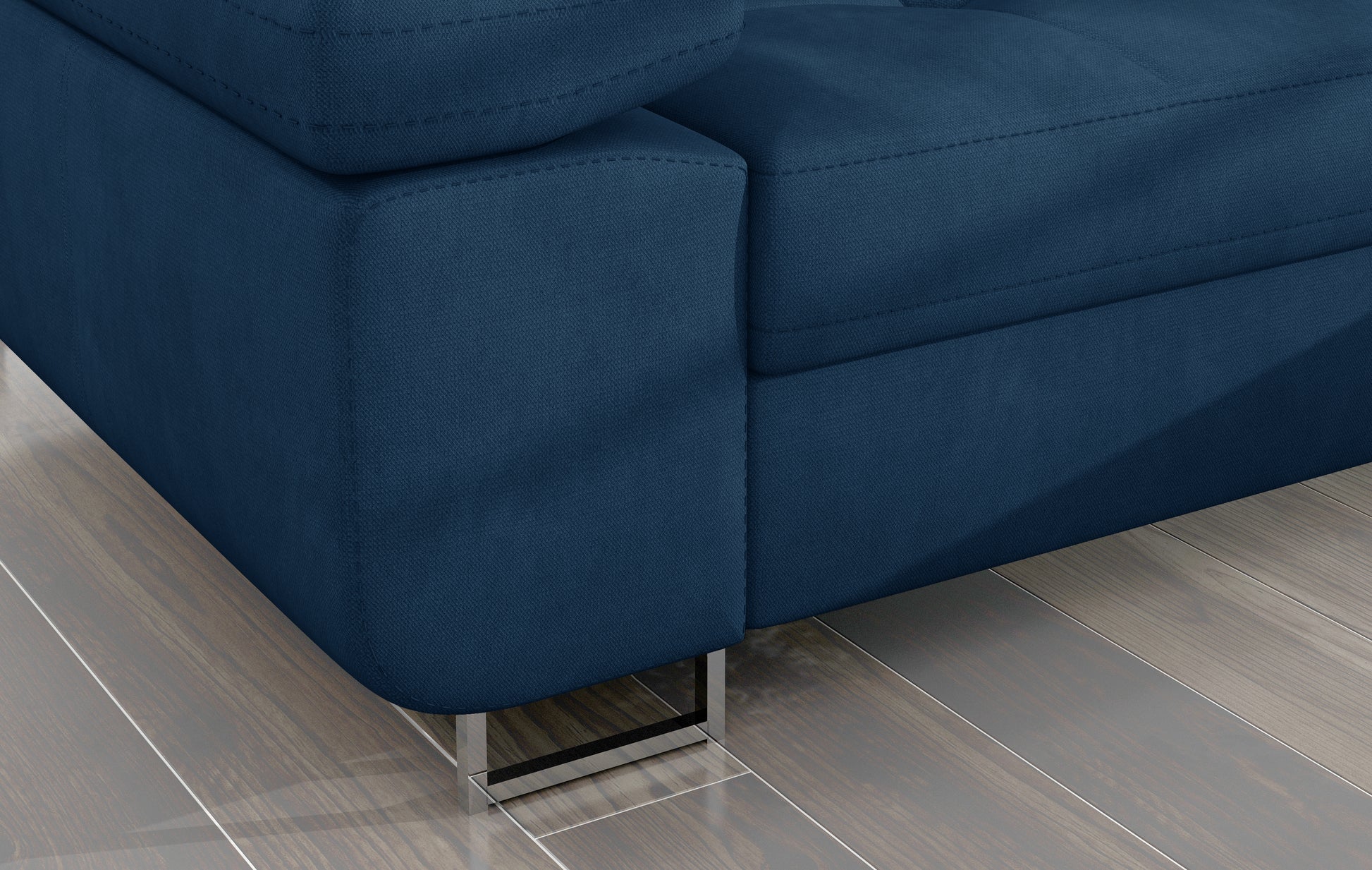 Detal narożnika Armando: granatowa tkanina Kronos 09 i poduszka Botanical 80 – widok narożnika z metalową nogą.